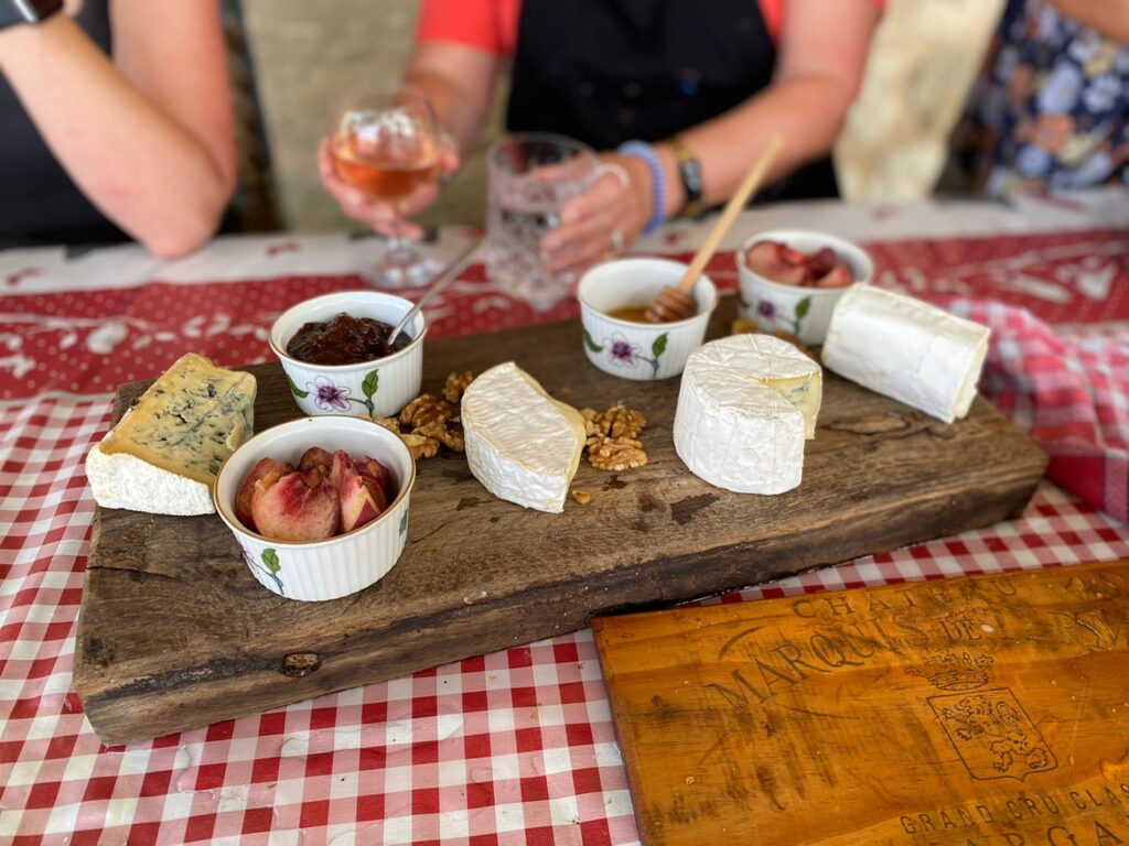 cheese board with figs walnuts and honey